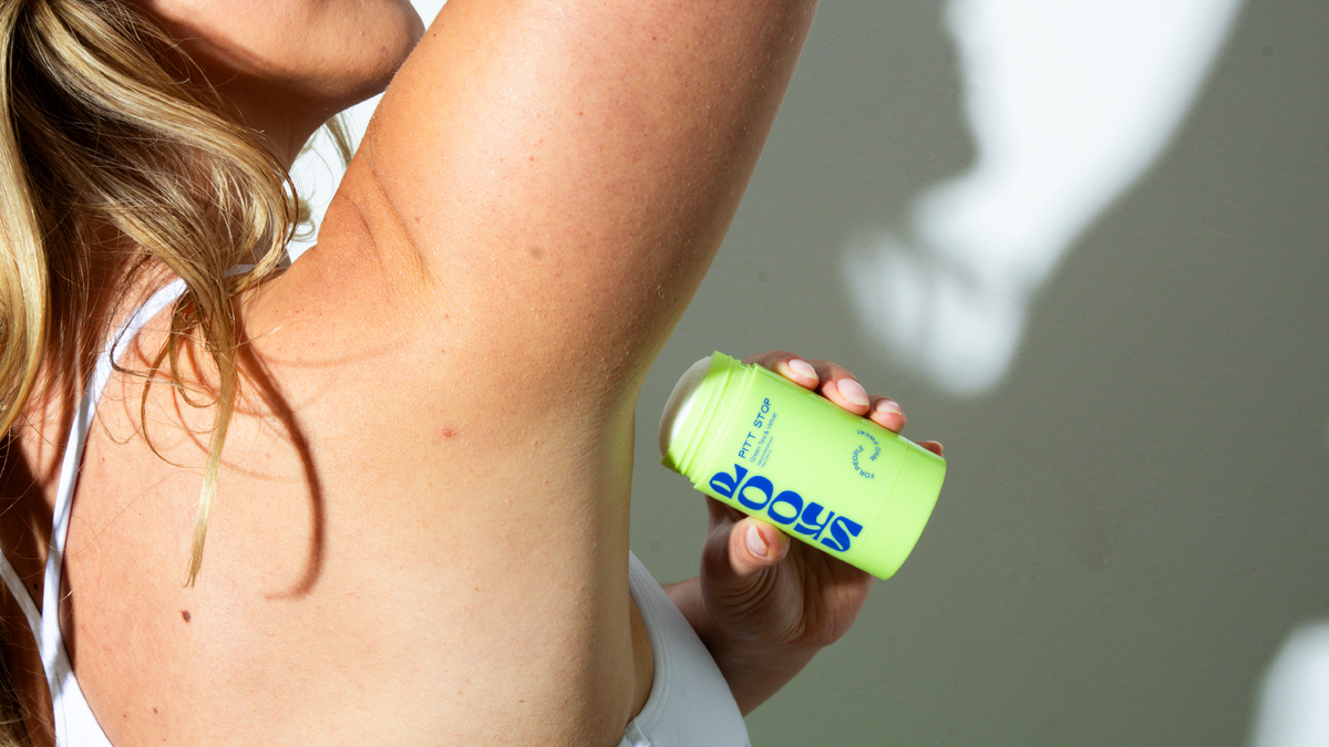 Pitt Stop Green Tea + Vetiver held under a raised arm