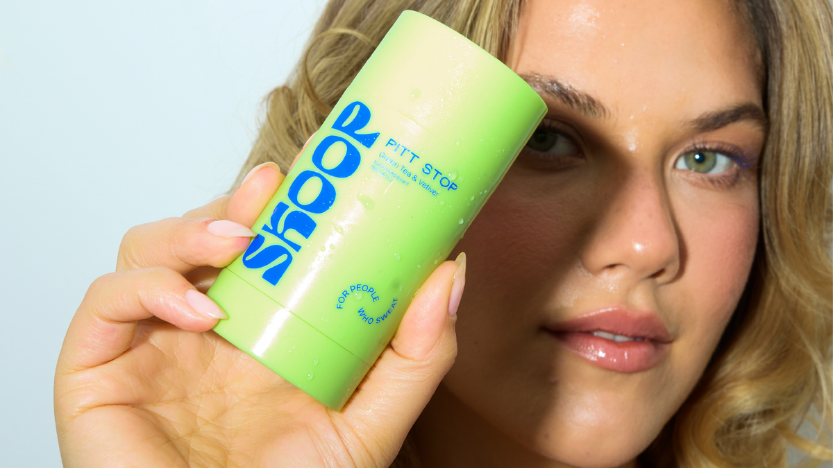 Close-up of Pitt Stop Green Tea + Vetiver held to the cheek