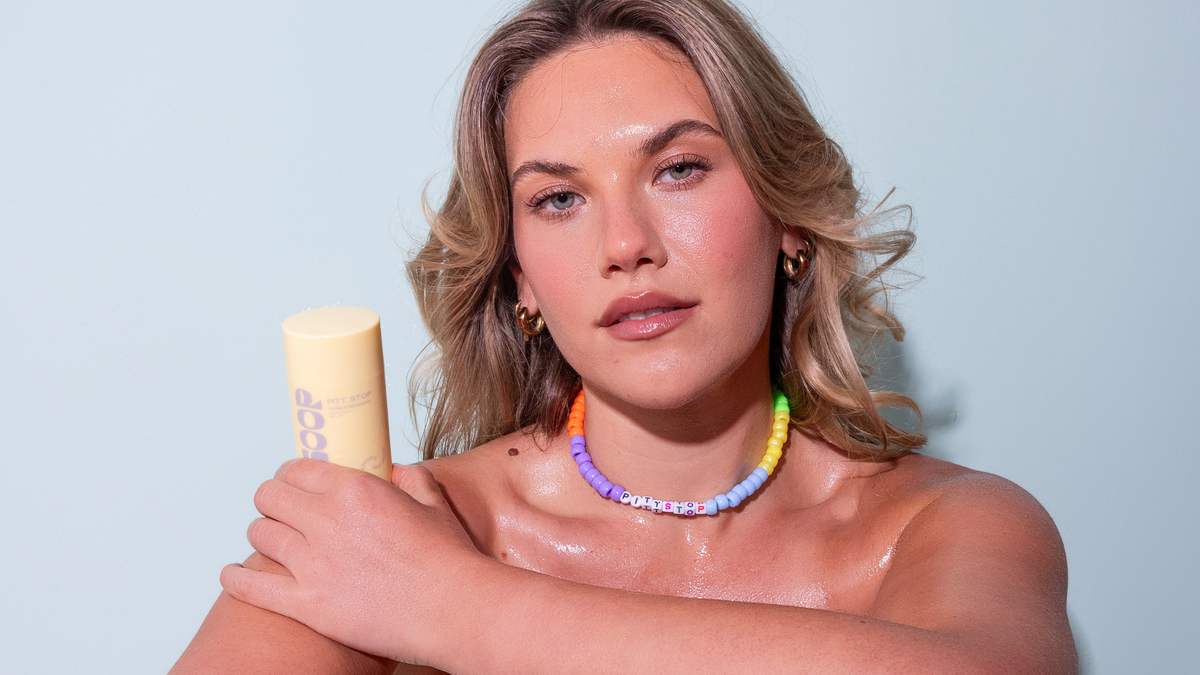 Woman holding Pitt Stop Vanilla + Macadamia